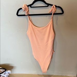 Cantaloupe color body suit!
